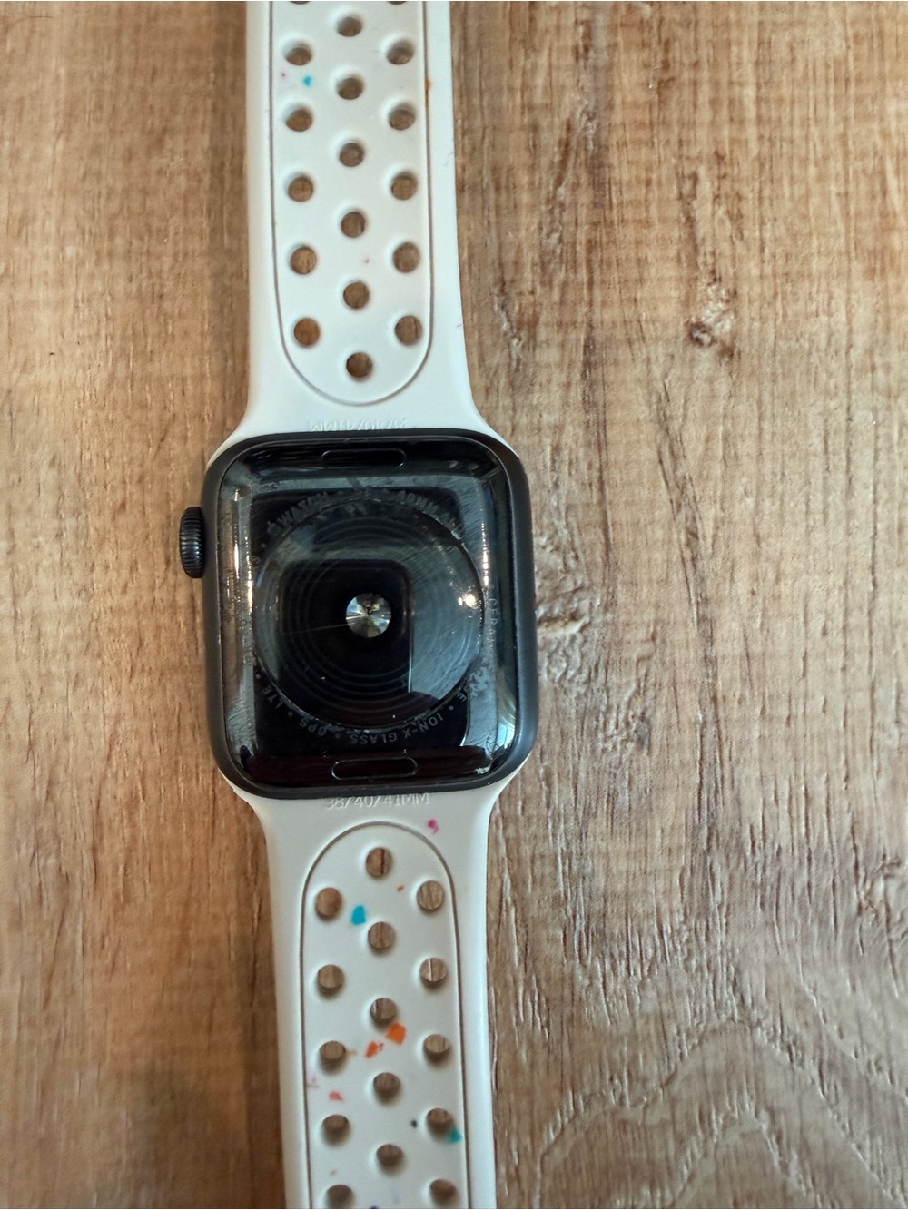 Apple Watch with White Speckled Sport Band and Charging Cable - Picture 2 of 3